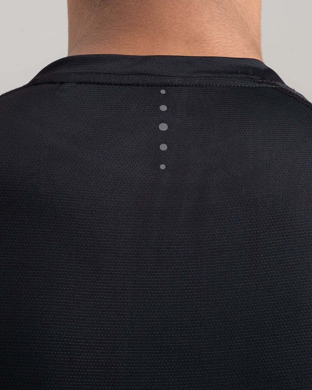 Back view of performance raglan T-shirt for men in black by KYRIX