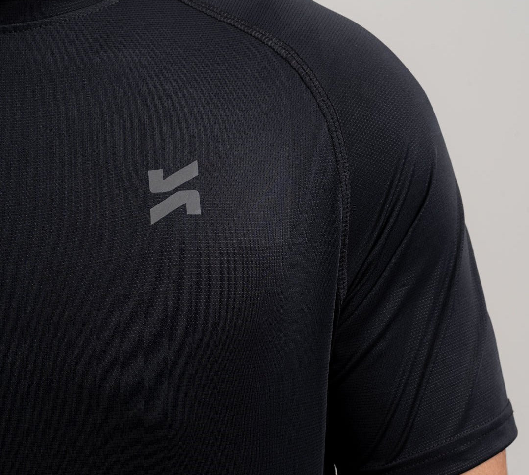Close-up of performance raglan T-shirt for men in black by KYRIX