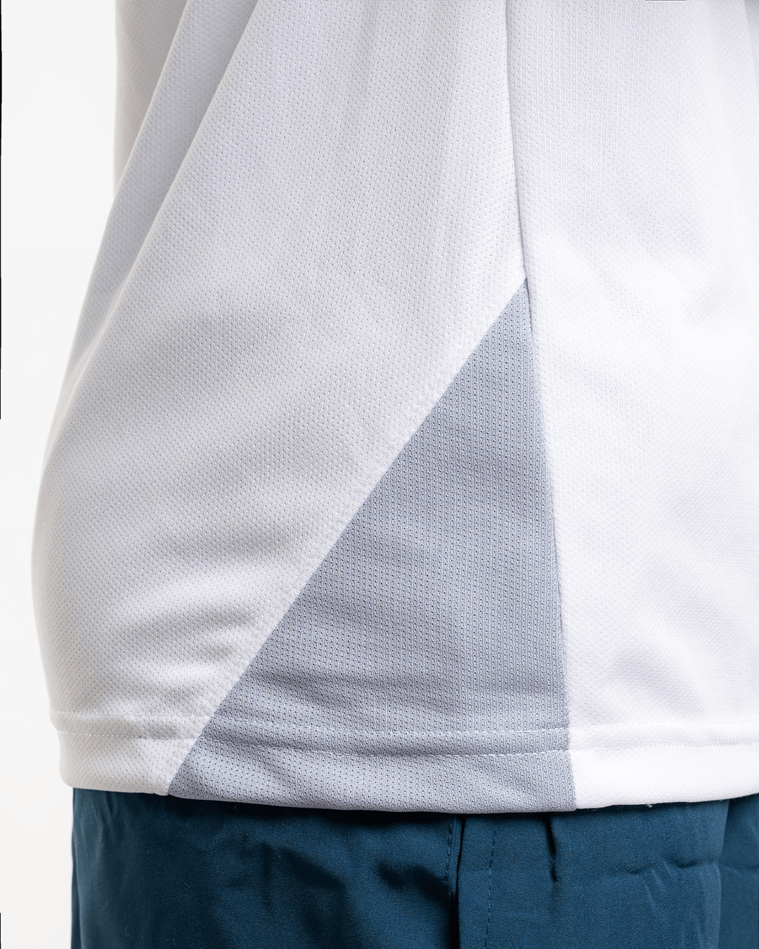 Close-up of core performance raglan T-shirt for men in white by KYRIX