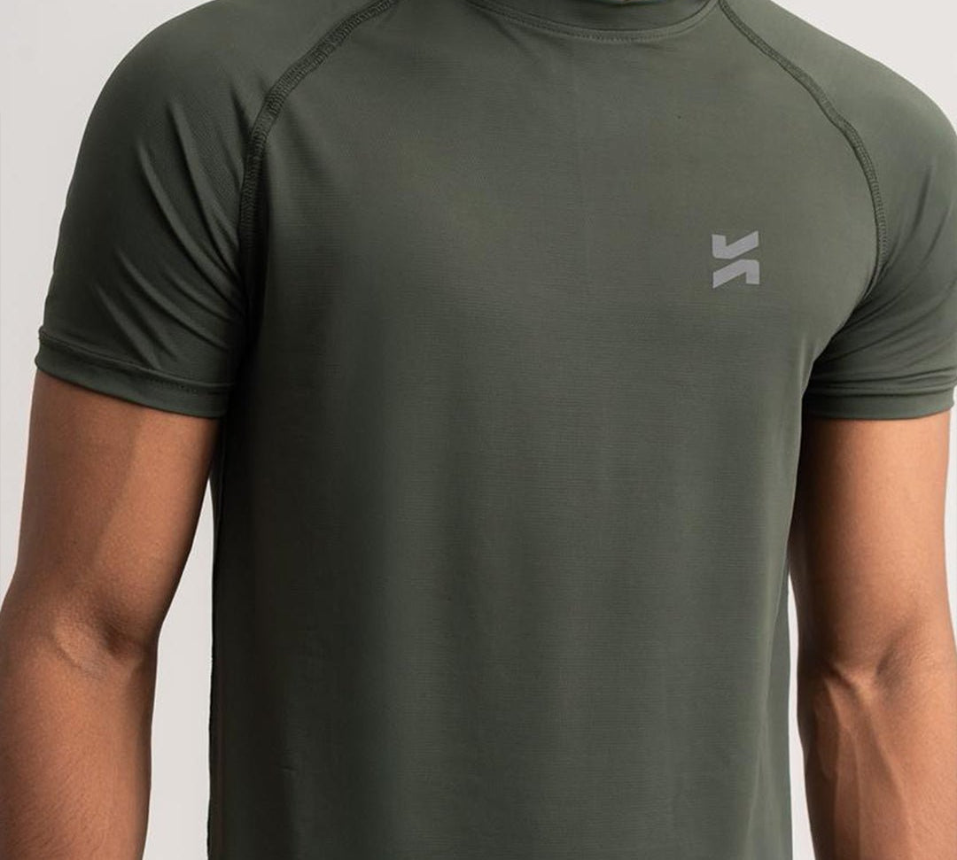 Close-up of lightweight raglan T-shirt for men in olive green by KYRIX